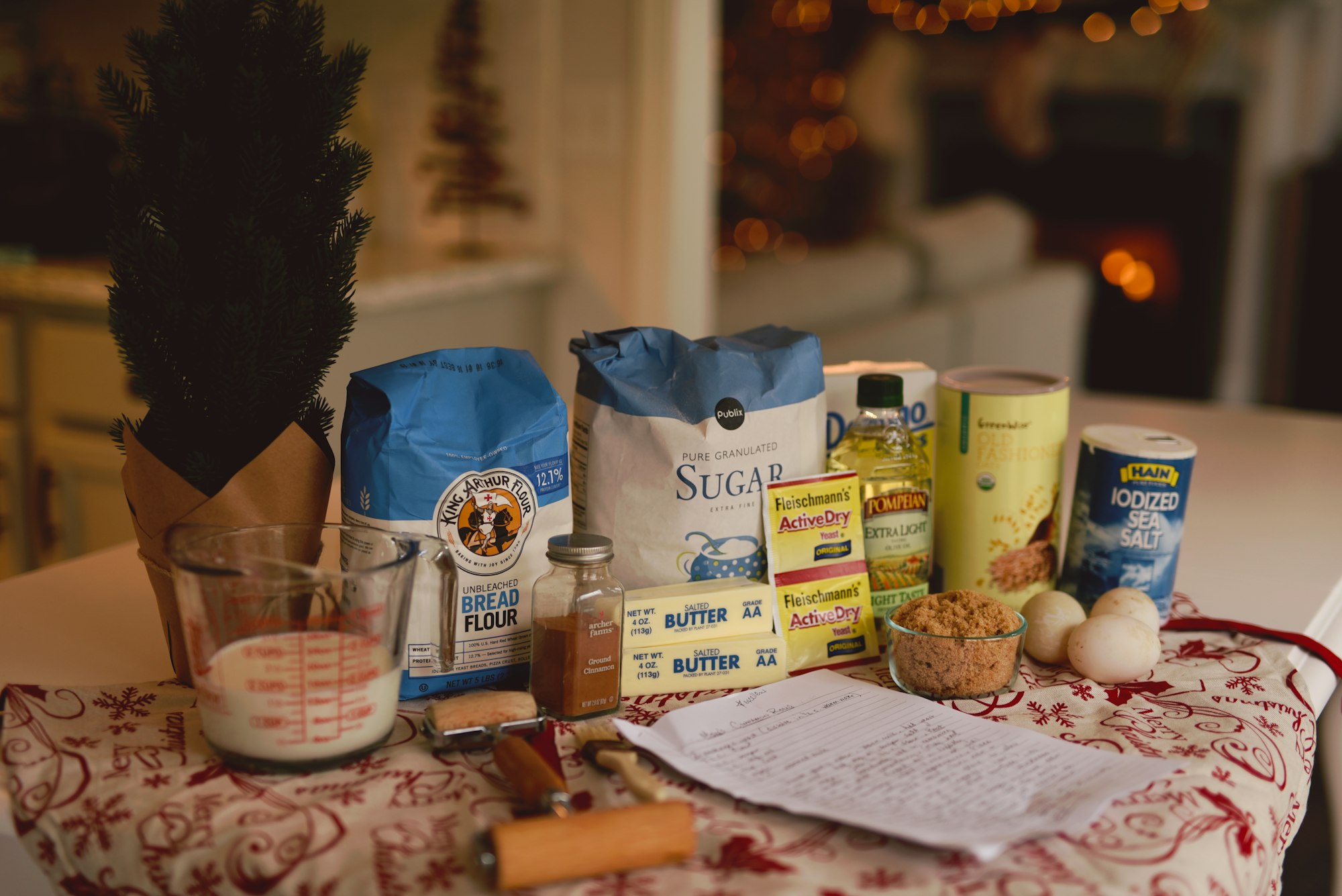 Flour, butter, almonds and vanilla on a wooden table