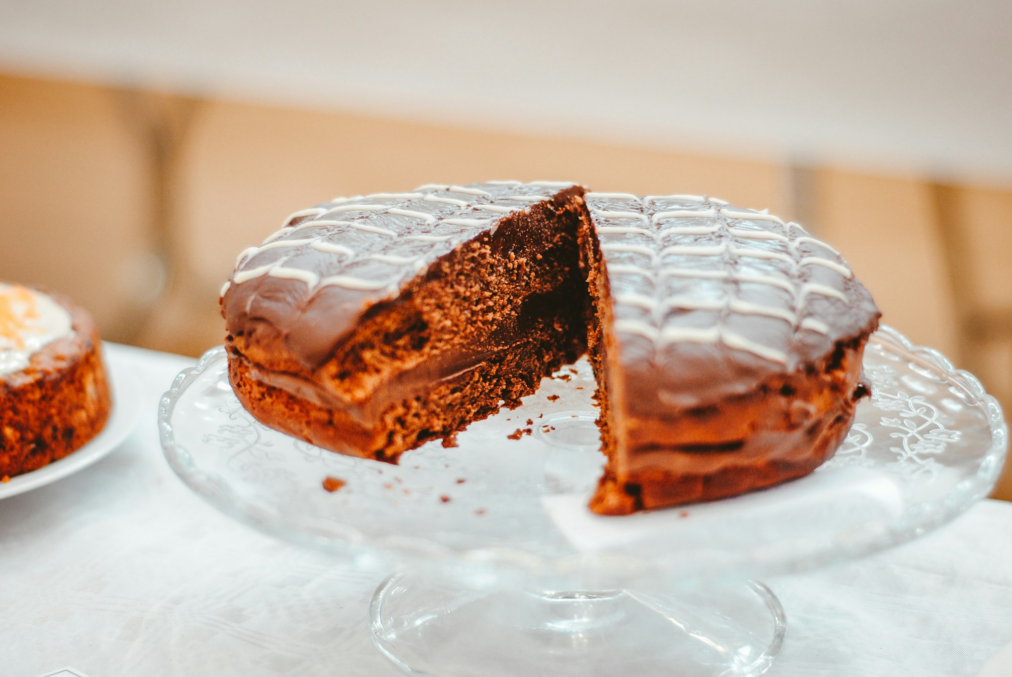A slice of Austrian Sachertorte on a white plate